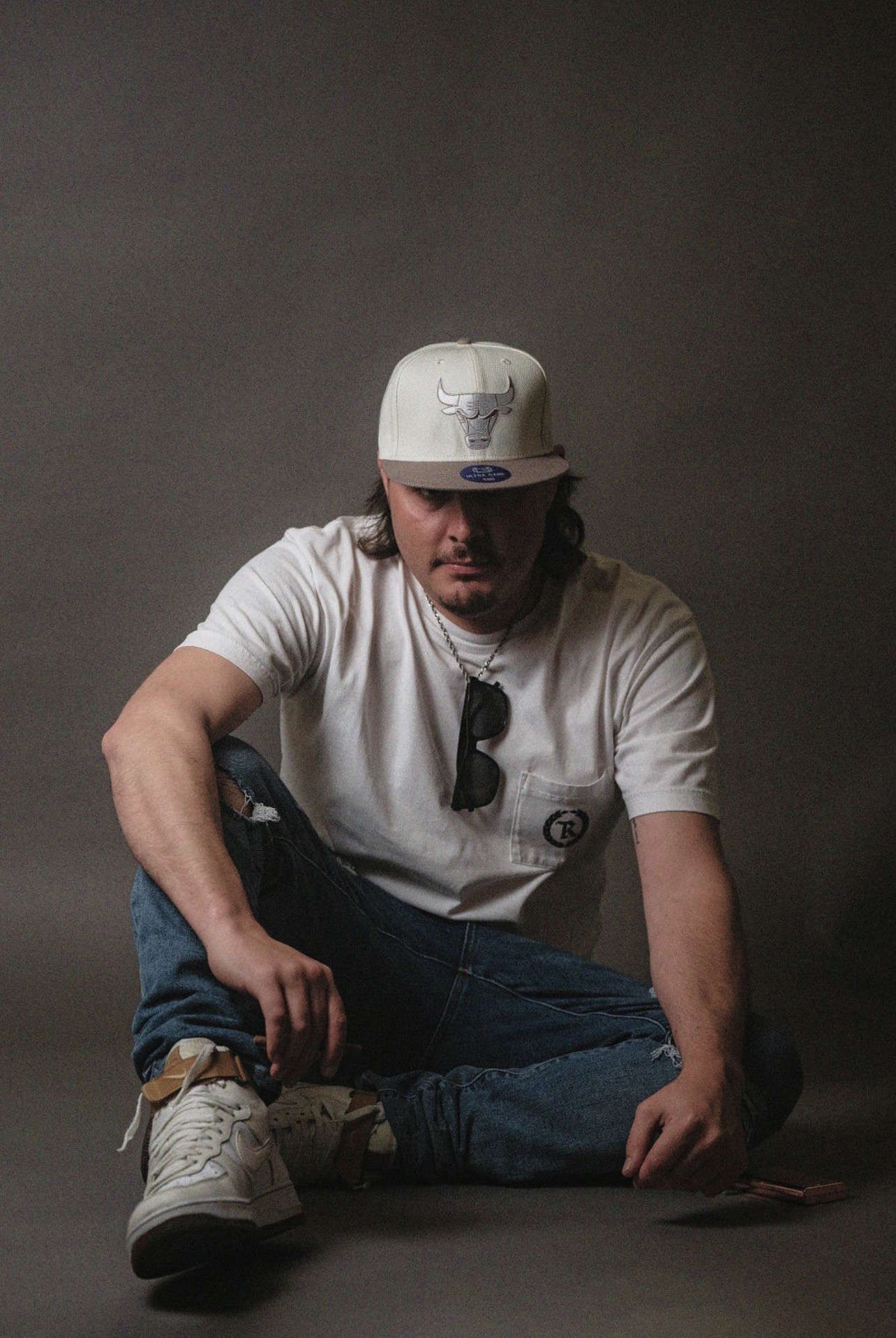 Brock White-Lyons sitting portrait for stand-up comedy and live entertainment website