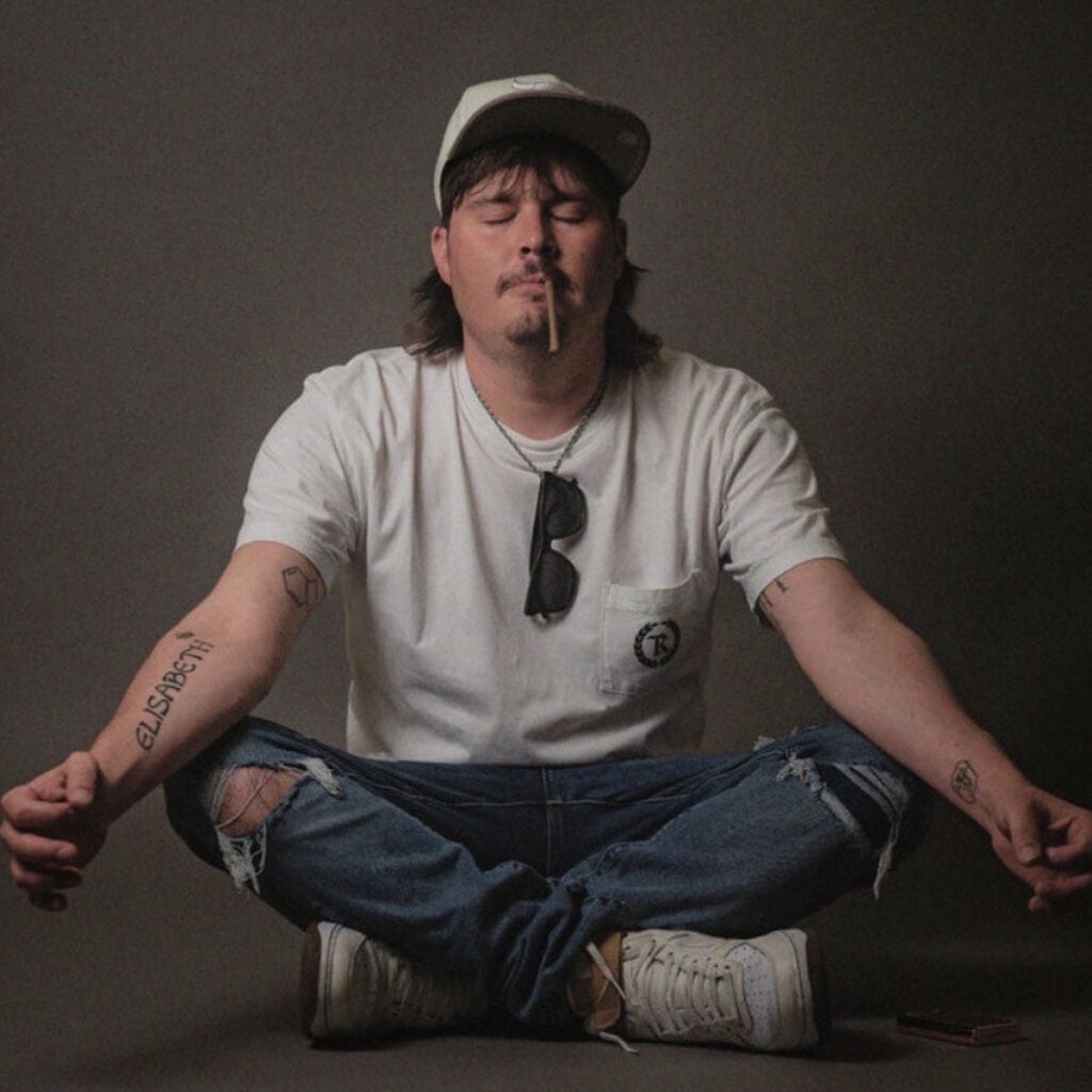 Brock White-Lyons seated portrait for comedy and entertainment profile